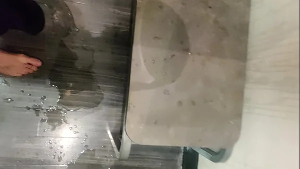 Pissing in a Fitting Room, Using a Pair of Pants