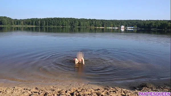 Naked girl goes skinny dipping in public beach