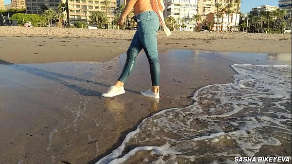 Wet shoot on a public beach with Crazy Model. Risky outdoor masturbation. Foot fetish. Pee in jeans.