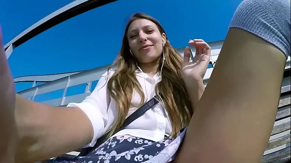Talia Mint plays in public with remote control toy over the phone with fan