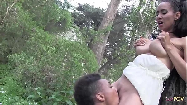 Outdoor interracial lesbian sex in a forest between a skinny ebony chick and a brunette with big tits